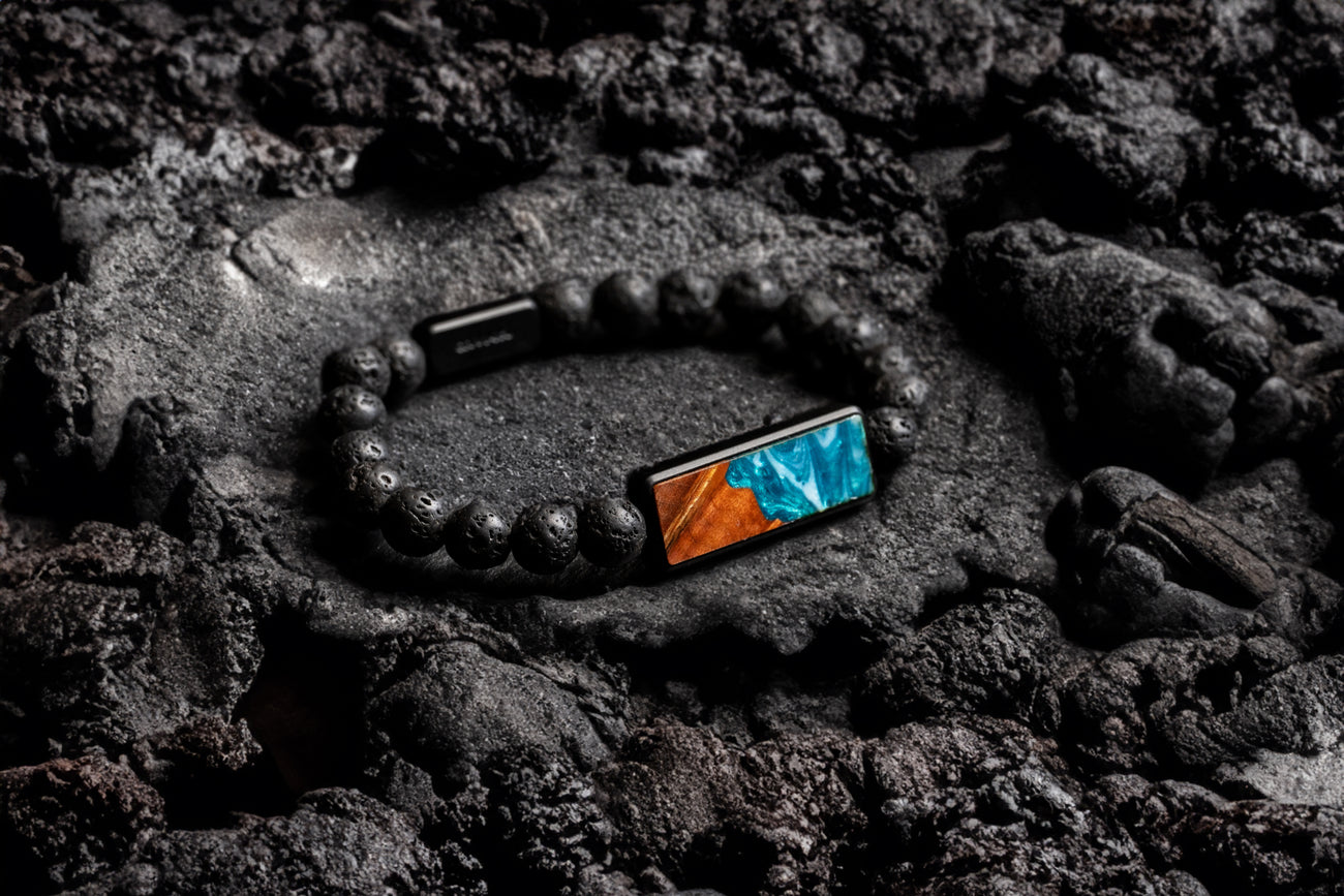 Lava bead bracelet sitting on rocks